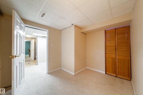 Wall-to-wall carpeted flooring with neutral wall paint - 10438 32A Avenue Nw, Edmonton, AB 