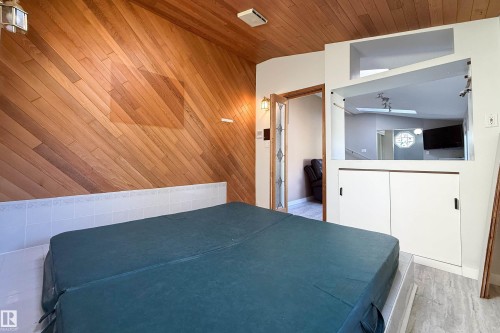 Spa area featuring diagonal wood paneling and a wood-finish ceiling - 10438 32A Avenue Nw, Edmonton, AB 