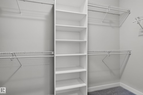 Built-in shelving unit, wire shelving, and hanging rods - 904 Armitage Court Sw, Edmonton, AB 