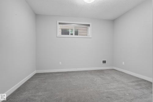 Recessed window with horizontal blinds - 904 Armitage Court Sw, Edmonton, AB 