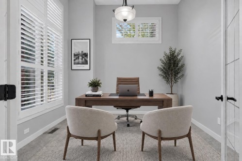 Window with white plantation shutters - 904 Armitage Court Sw, Edmonton, AB 