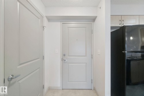 White interior doors with panel detailing - #406 11449 Ellerslie Rd Sw, Edmonton, AB 
