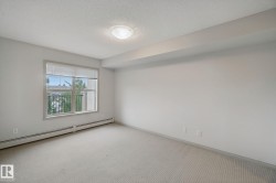 Neutral wall finishes, textured ceiling, window with blinds, and wall-to-wall carpeting - 