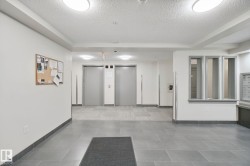 Tile flooring, flush-mount ceiling lighting, dual elevators, built-in mailboxes - 