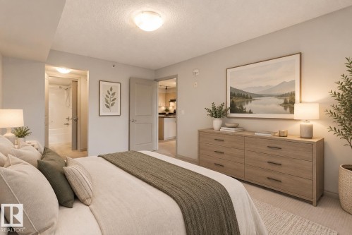 Wall-to-wall carpeting with light-toned wall finishes - #406 11449 Ellerslie Rd Sw, Edmonton, AB 