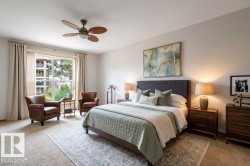 Large Primary bedroom with a French door to the  balcony. Light & bright with large windows.  This room has been Virtually Staged. - 
