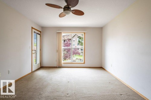 A huge Primary bedroom with French door access to the balcony. - #203 8912 156 St Nw, Edmonton, AB 