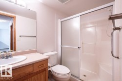 This is the main bathroom located by the Den & 2nd bedroom.  It features a large shower with a seat and grab bar. - 