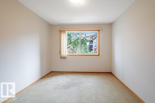 2nd bedroom a spacious room with bright windows overlooking the garden and pond. - #203 8912 156 St Nw, Edmonton, AB 