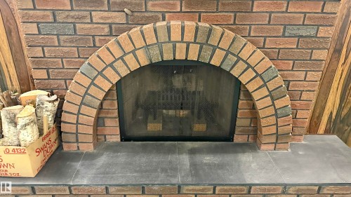 Wood burning fireplace. - 4128 110 Street Nw, Edmonton, AB 