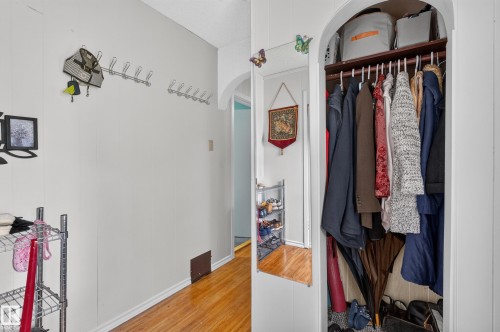 Recessed closet with a built-in shelving unit and clothing rod - 12309 80 Street Nw, Edmonton, AB 