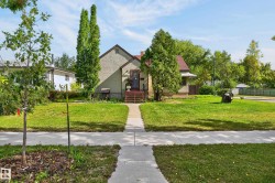 Gabled roofline, stucco exterior, and red-toned entry steps - 