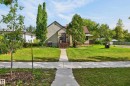 Gabled roofline, stucco exterior, and red-toned entry steps - 12309 80 Street Nw, Edmonton, AB 