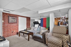 Red brick accent wall with two white doors - 