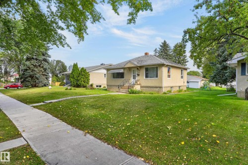 Single-story residence with a stucco exterior and a pitched roof - 12345 79 Street Nw, Edmonton, AB 