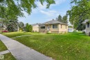 Single-story residence with a stucco exterior and a pitched roof - 12345 79 Street Nw, Edmonton, AB 