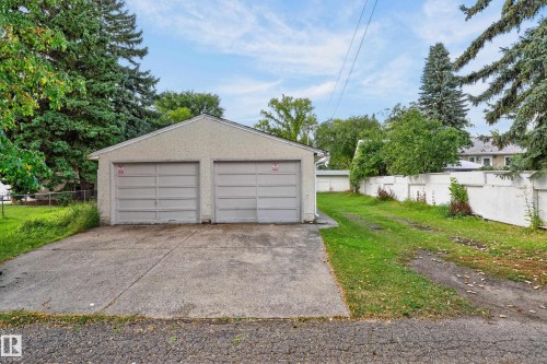 Two-car detached garage with stucco exterior and concrete driveway - 12345 79 Street Nw, Edmonton, AB 