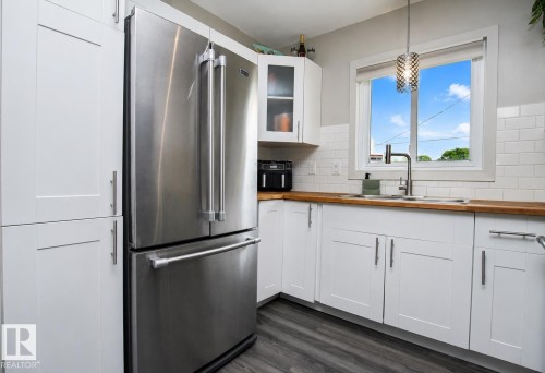 12231 55 Street Nw, Edmonton, AB - Indoor Photo Showing Kitchen With Double Sink