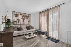 Wood-finish flooring throughout the space - 