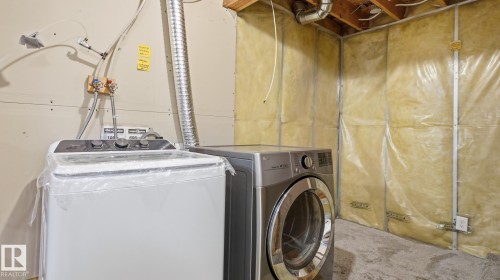 Utility area with concrete flooring and exposed ceiling joists - 2117 36 Avenue Nw, Edmonton, AB 