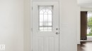 White entry door with decorative glass insert - 2117 36 Avenue Nw, Edmonton, AB 