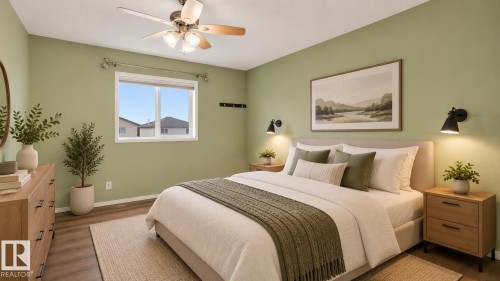 Wood-finish flooring, single window with white trim, ceiling fan with integrated lighting, and wall-mounted sconce lighting - 2117 36 Avenue Nw, Edmonton, AB 