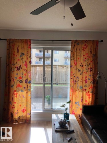 Wood-finish flooring, sliding glass door, ceiling fan - #103 10346 117 St Nw, Edmonton, AB 