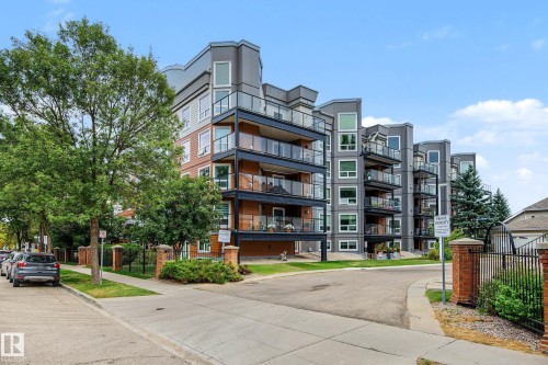 Modern multi-story building featuring extensive balconies with glass railings - #505 7839 96 St Nw, Edmonton, AB 