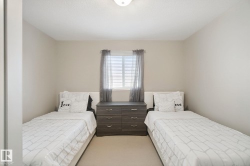 Neutral wall tones, recessed ceiling light, and window with blinds - 13912 156 Avenue Nw, Edmonton, AB 