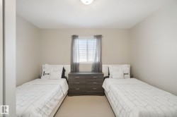Neutral wall tones, recessed ceiling light, and window with blinds - 