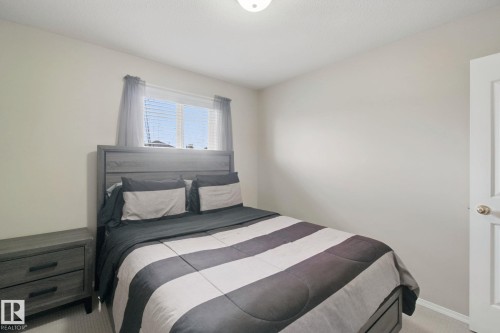 Neutral wall color, window with blinds, overhead lighting, and carpeted flooring - 13912 156 Avenue Nw, Edmonton, AB 