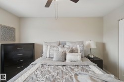Neutral wall color, ceiling fan, white door, and recessed lighting - 