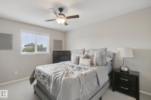 Window with horizontal blinds, overhead ceiling fan with lighting, and carpeted flooring - 13912 156 Avenue Nw, Edmonton, AB 