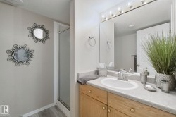 Oak wood-finish vanity with a built-in sink and chrome faucet - 