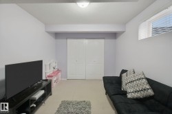 Recessed ceiling light fixture, bi-fold closet doors, and upper window with horizontal blinds - 