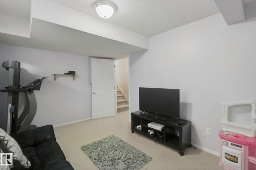 Carpeted flooring, neutral wall paint, overhead lighting, and interior door - 13912 156 Avenue Nw, Edmonton, AB 