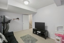 Carpeted flooring, neutral wall paint, overhead lighting, and interior door - 