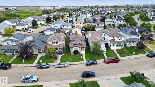 Residential street with a variety of architectural styles, including two-story and single-story homes - 13912 156 Avenue Nw, Edmonton, AB 