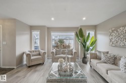 Recessed lighting illumination, light wood-finish flooring, and multiple windows - 