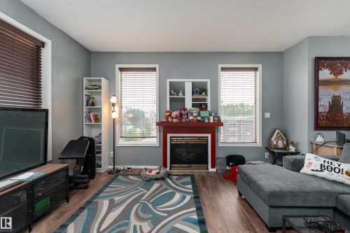 #301 8108 109 St Nw, Edmonton, AB - Indoor Photo Showing Living Room With Fireplace