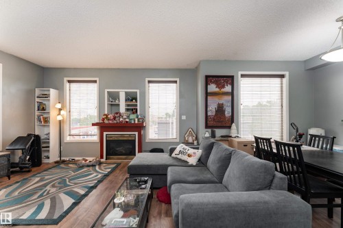 #301 8108 109 St Nw, Edmonton, AB - Indoor Photo Showing Living Room With Fireplace