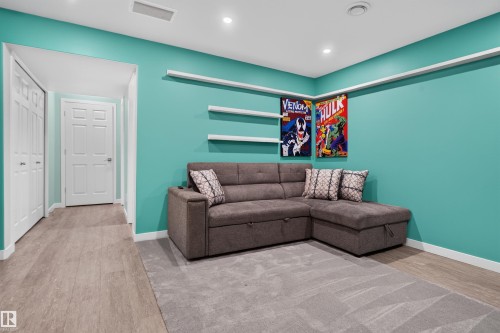 Recessed lighting, wood-finish flooring, two-panel interior doors, and built-in wall shelving - 319 Desrochers Boulevard Sw, Edmonton, AB 