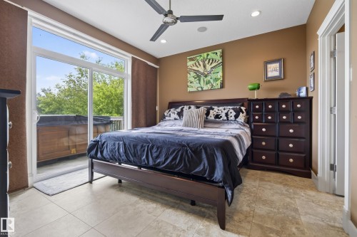 Spacious room featuring neutral tile flooring and a ceiling fan with integrated lighting - 48109 Rr 155, Rural Beaver County, AB - Indoor Photo Showing Bedroom