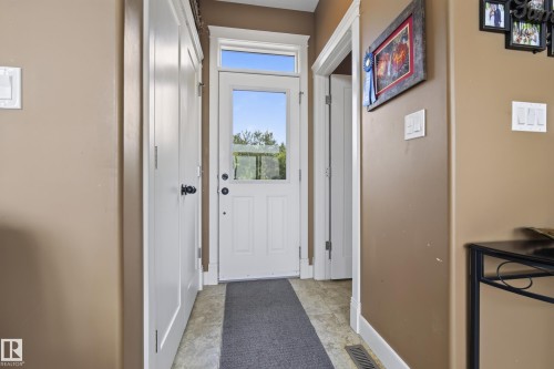 Entryway featuring a white door with a clear glass insert and an overhead transom window - 48109 Rr 155, Rural Beaver County, AB - Indoor Photo Showing Other Room