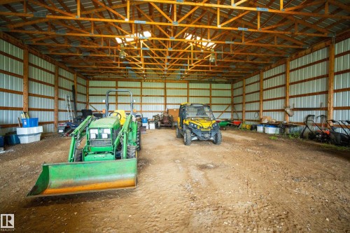 Spacious pole barn with a metal roof and exposed wood truss system - 48109 Rr 155, Rural Beaver County, AB - Indoor