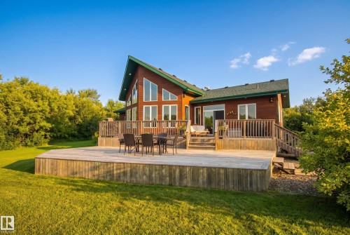 Expansive multi-level wood deck, a prominent feature of this wood-sided home - 48109 Rr 155, Rural Beaver County, AB - Outdoor With Deck Patio Veranda