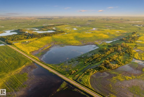 Expansive agricultural landscape featuring multiple bodies of water and verdant fields - 48109 Rr 155, Rural Beaver County, AB - Outdoor With View
