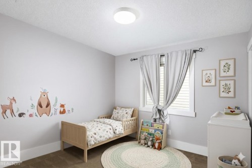 Recessed lighting fixture and a window with blinds and drapes - 886 Armitage Wynd Sw, Edmonton, AB 