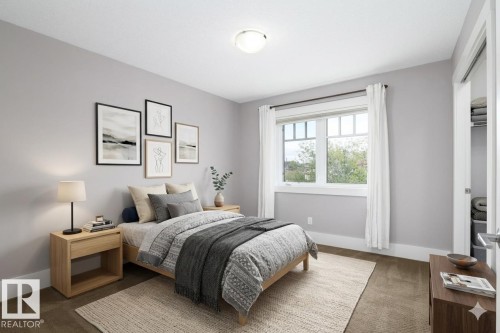 Neutral wall tones, carpeted flooring, a multi-pane window, and a built-in closet - 886 Armitage Wynd Sw, Edmonton, AB 