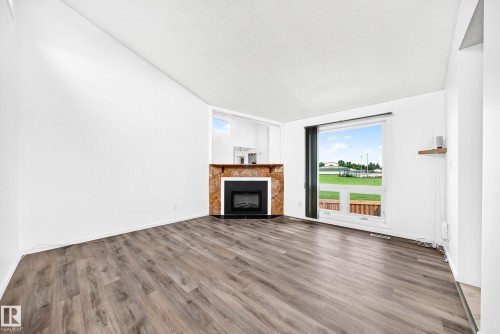 14141 26 Street Nw, Edmonton, AB - Indoor Photo Showing Living Room With Fireplace